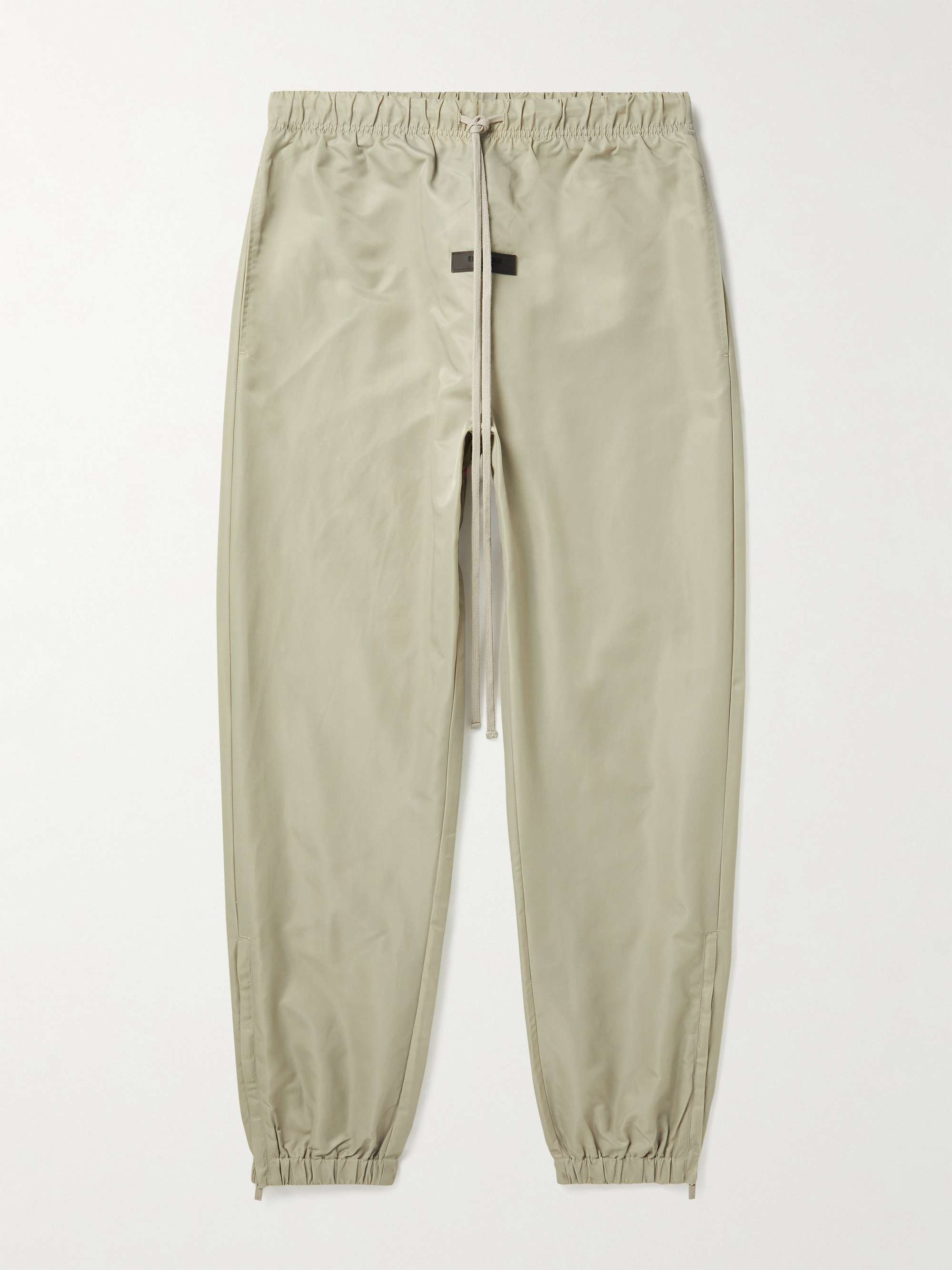 FEAR OF GOD ESSENTIALS Slim-Fit Tapered Logo-Appliquéd Nylon Sweatpants for  Men | MR PORTER