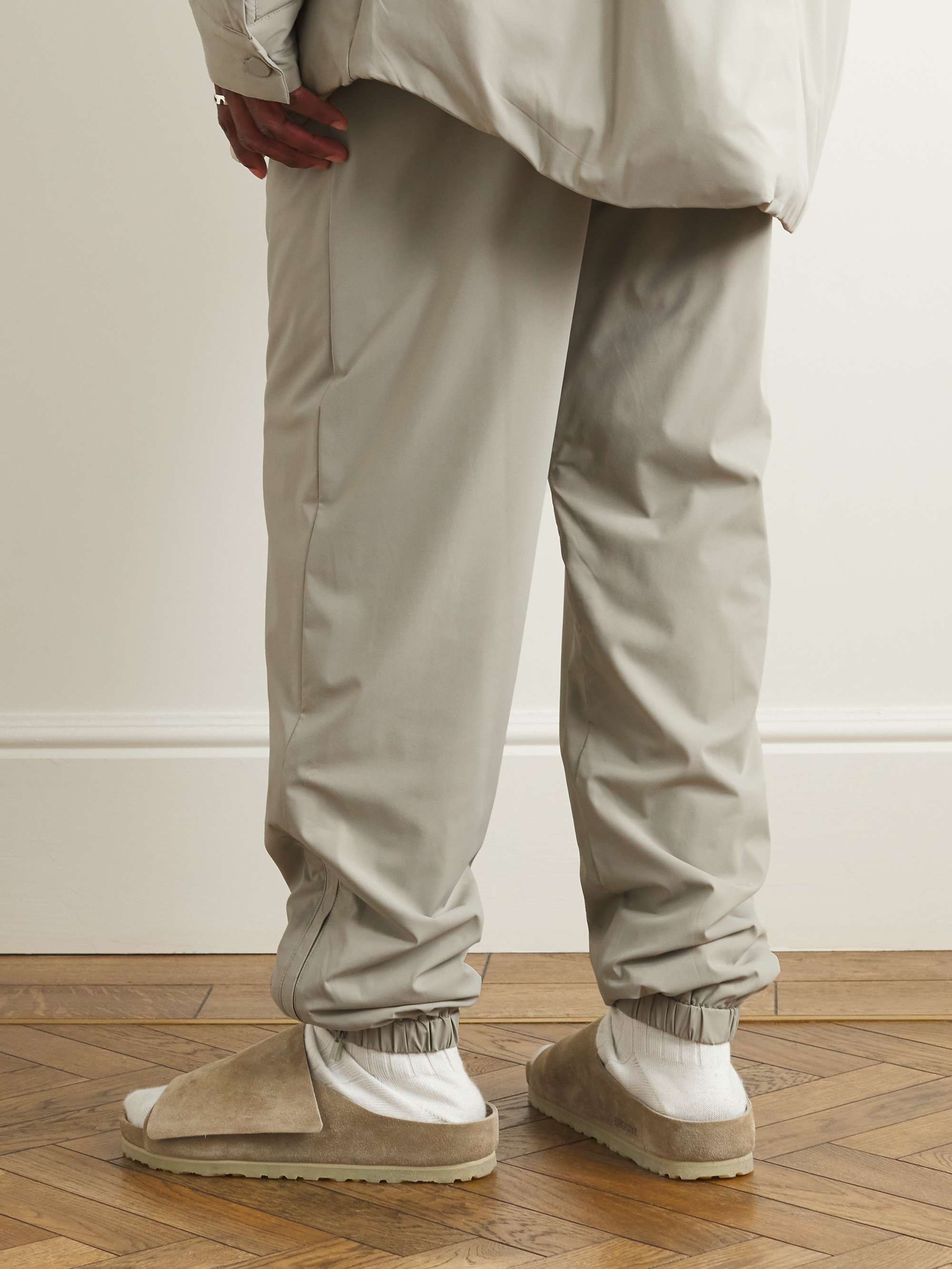 FEAR OF GOD ESSENTIALS Tapered Logo-Appliquéd Nylon-Blend Track Pants for  Men | MR PORTER