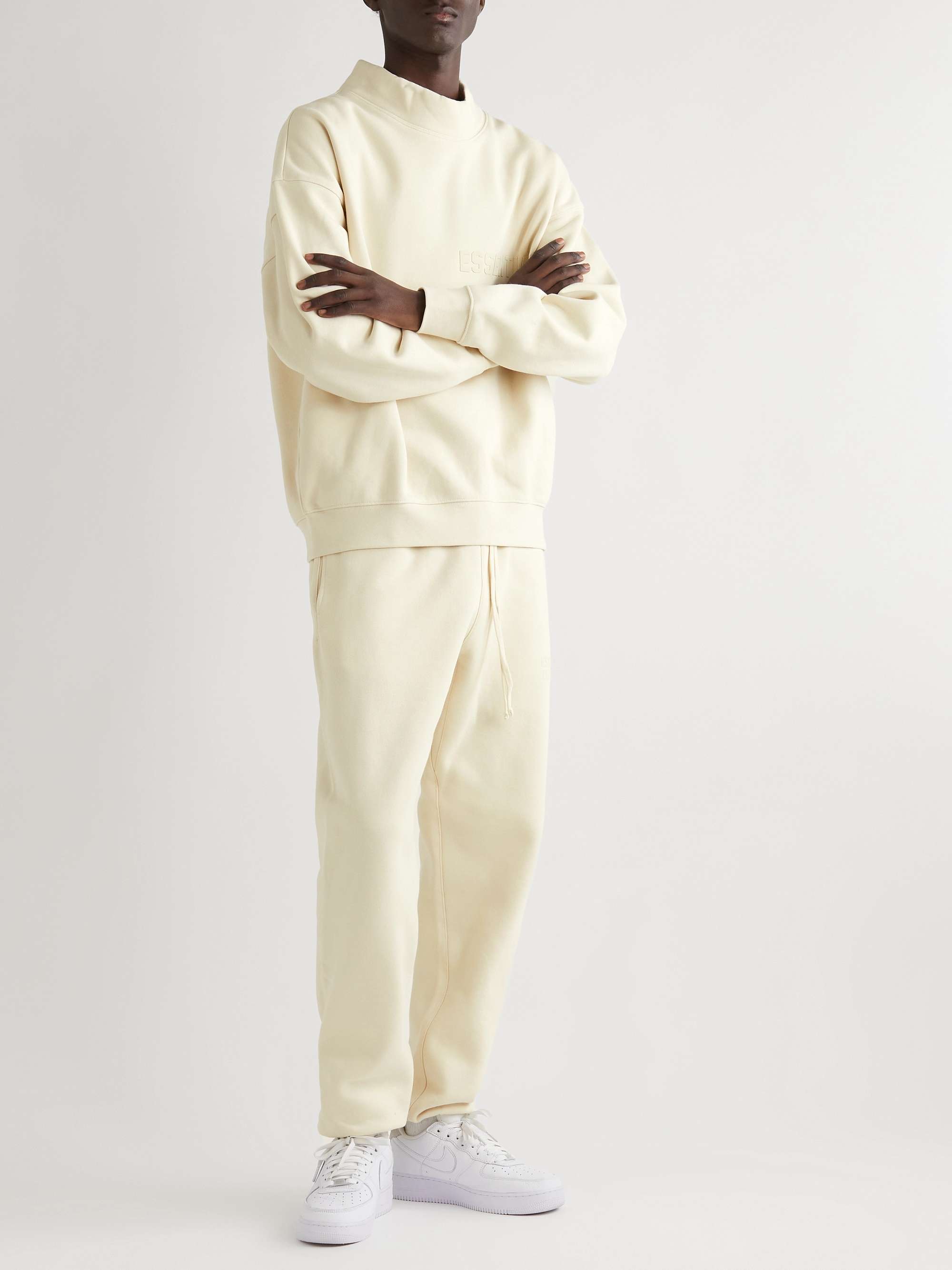 FEAR OF GOD ESSENTIALS Slim-Fit Tapered Logo-Flocked Cotton-Blend Jersey  Sweatpants | MR PORTER