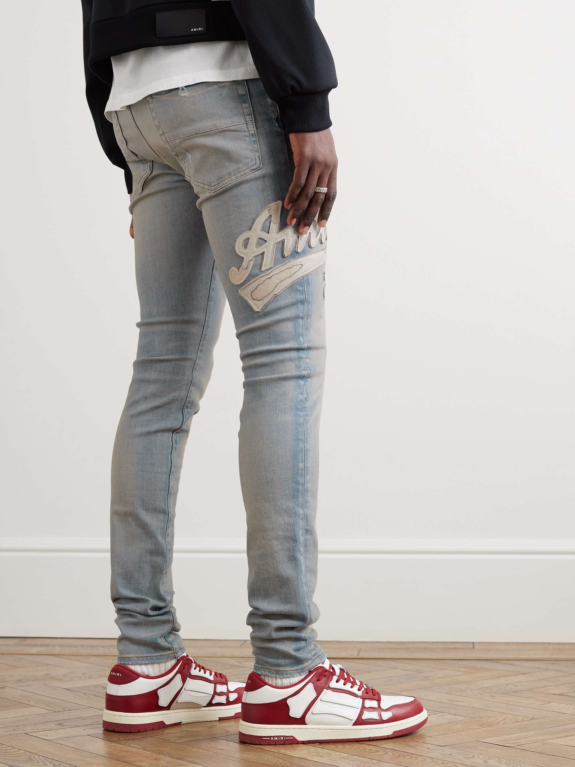 AMIRI Varsity Skinny-Fit Leather-Appliquéd Jeans | MR PORTER
