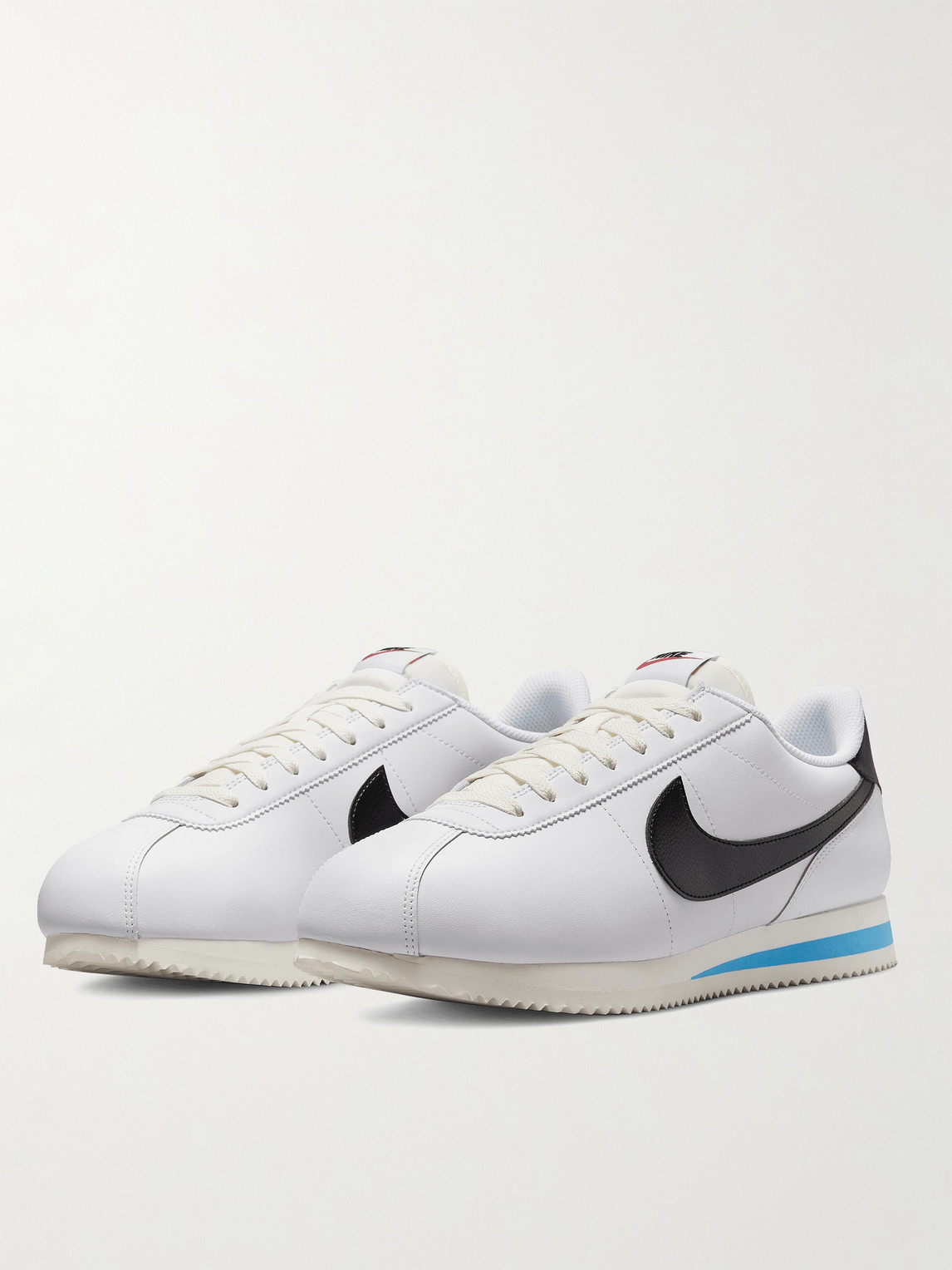 Shop Nike Cortez Leather Sneakers In White