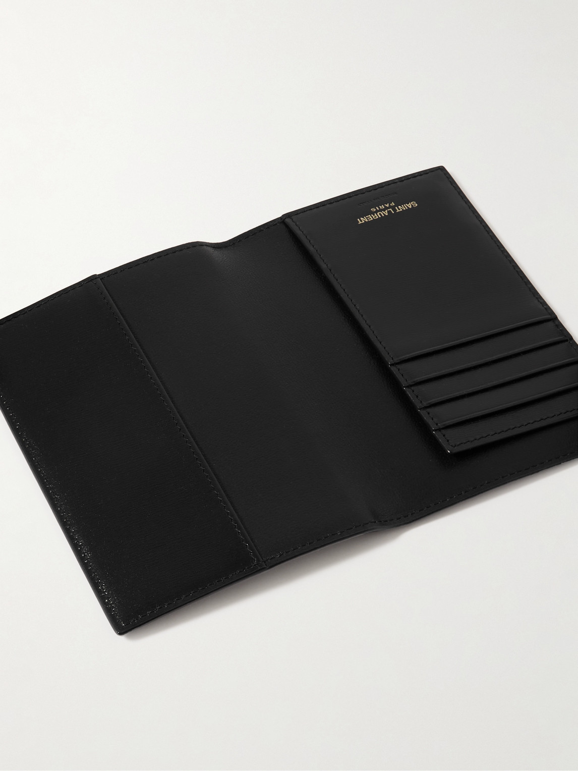 Shop Saint Laurent Cassandre Logo-embellished Glossed-leather Passport Cover In Black