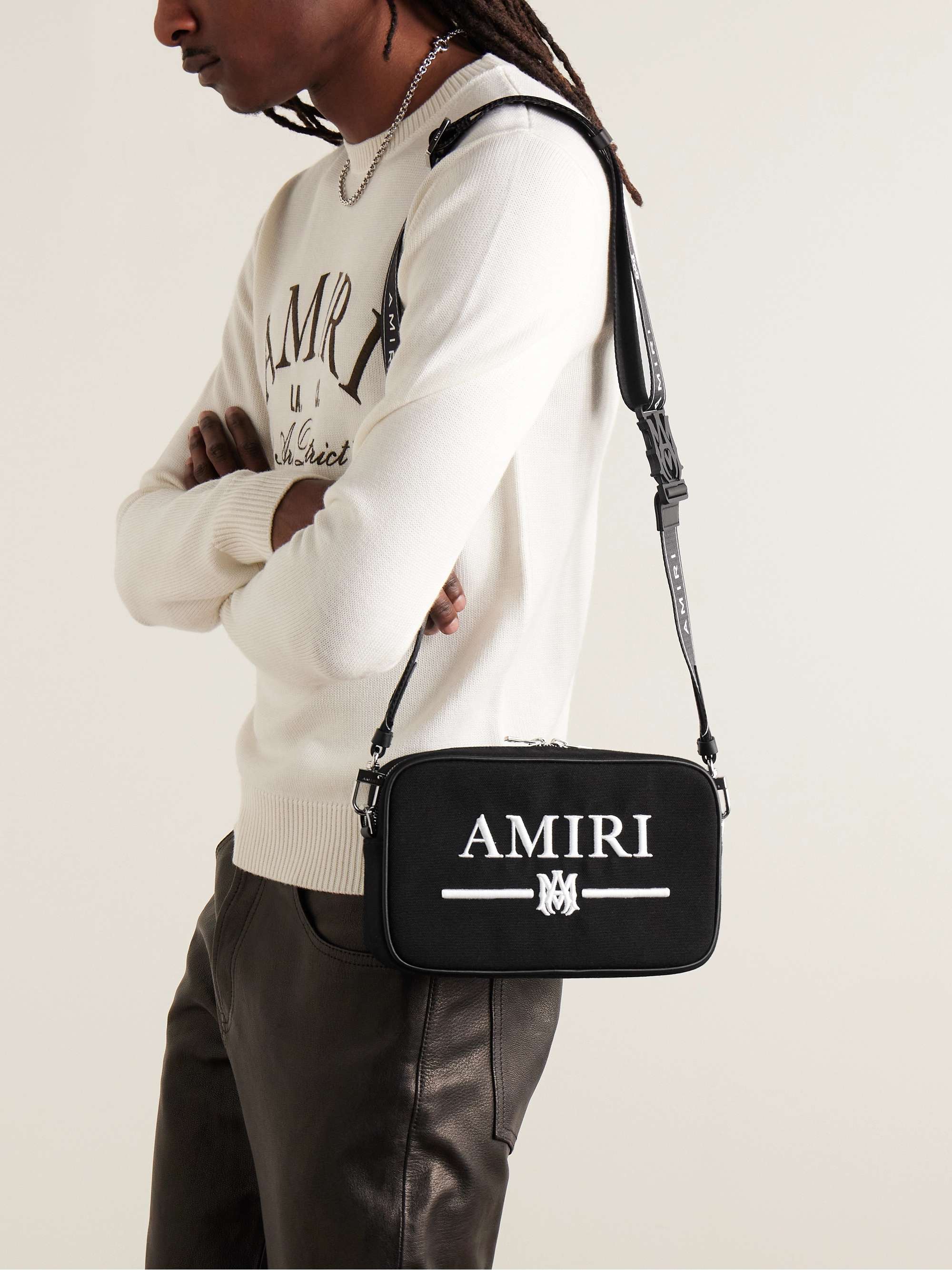 AMIRI Leather-Trimmed Logo-Embroidered Canvas Messenger Bag for Men | MR  PORTER