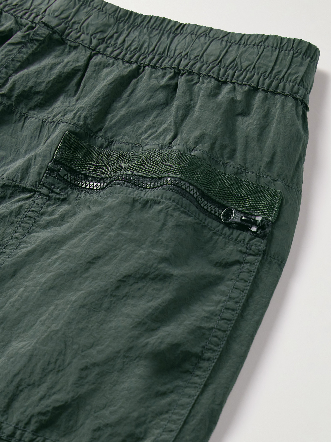 Shop Stone Island Tapered Logo-appliquéd Econyl® Nylon Metal Trousers In Green